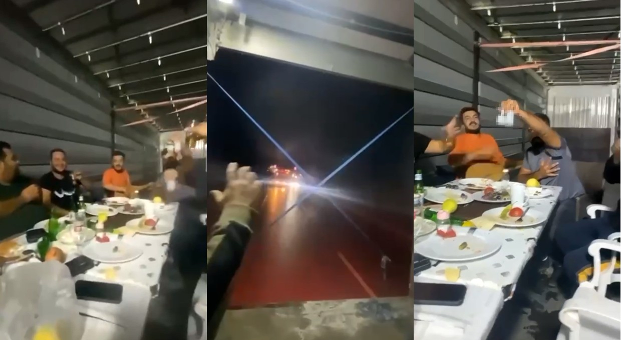 Hareket halindeki TIR'ın dorsesine masa kurup içki içtiler