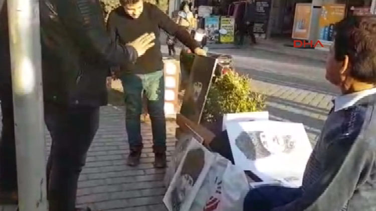 Sivil polisten portre satan mültecilere: "Bizde Atatürk yerde durmaz, yukarı kaldırın!"