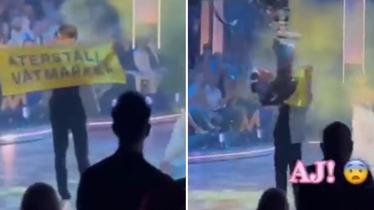 Sahneye çıkan aktivisti kamera ile böyle düşürdü