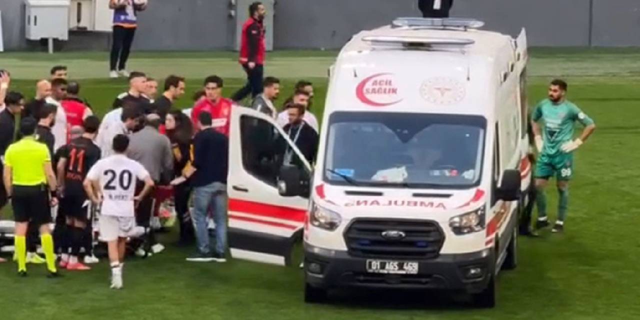 Kulüp personeli bayılan futbolcuyu taşıdı