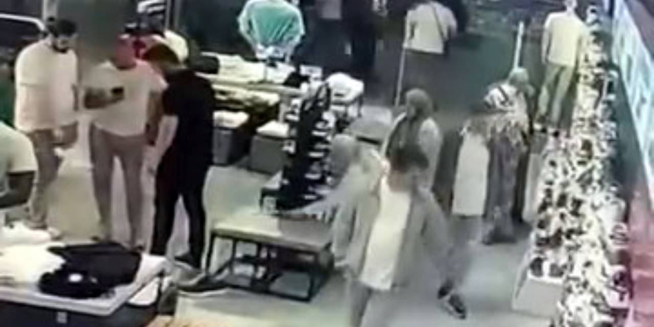 Telefon çalan peçeli kadın kameralara yakalandı