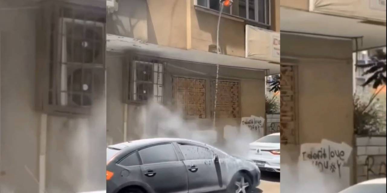 Evin önünde yanan otomobile kovayla müdahale etti