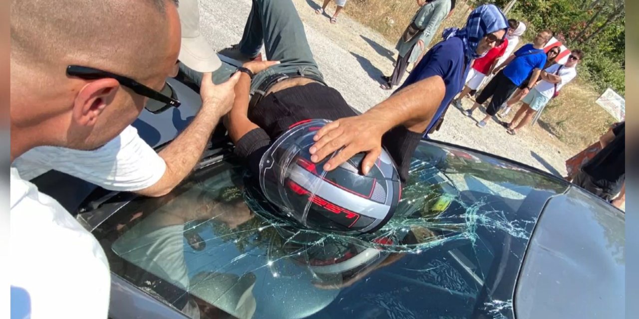 Üzerine düştüğü otomobilin ön camında ambulans bekledi