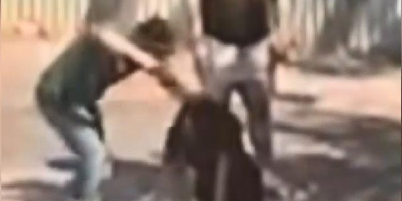 Sokak ortasında kafasına silah dayadığı kadını darp etti