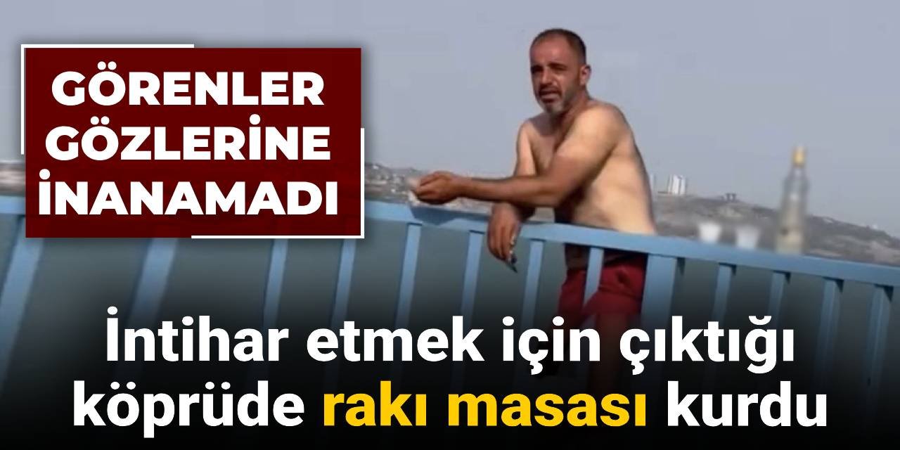 İntihar etmek için çıktığı köprüde alkol masası kurdu