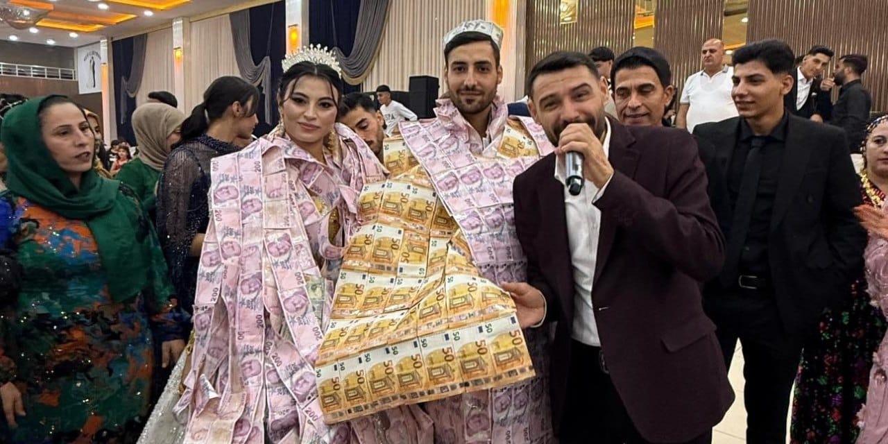 Aşiret düğününde gelin ve damada paradan yelek giydirdiler