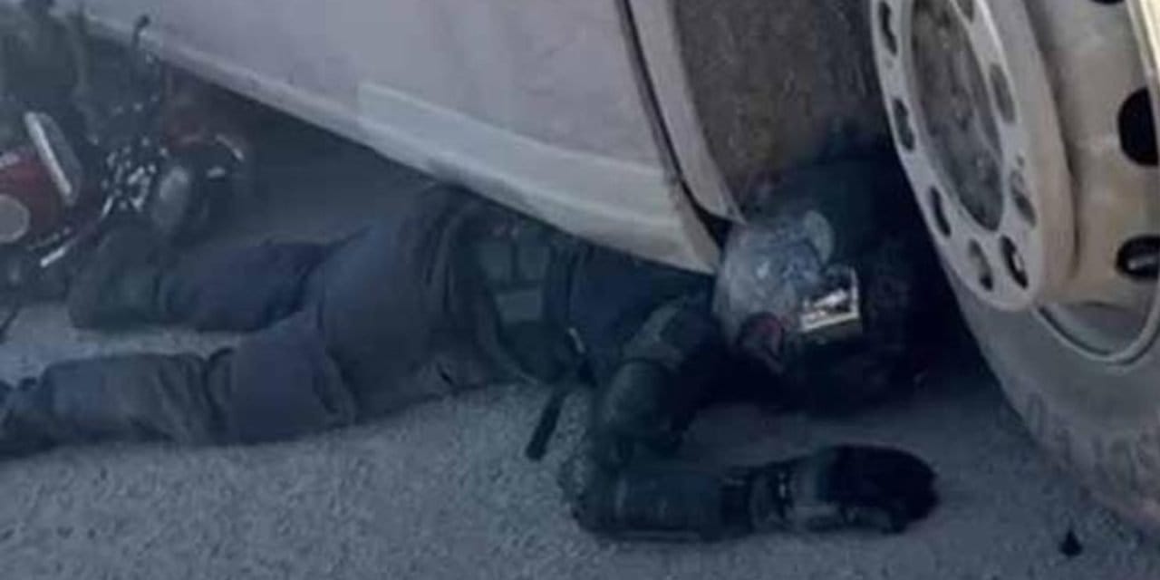 TIR'ın altında sürüklenen kurye ekipmanları sayesinde kurtuldu