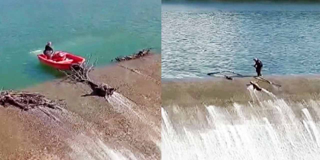 Metrelerce yüksekten su akarken barajda temizlik yaptı: Yürekleri ağza getirdi