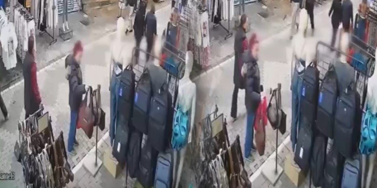 Yanından geçenlere de aldırış etmedi! Mağaza önünden hırsızlık kamerada
