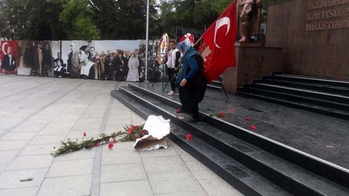 Çelenkleri parçalayan kadın adli kontrolle serbest