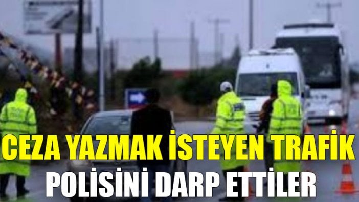 Ceza yazmak isteyen trafik polisini darp ettiler