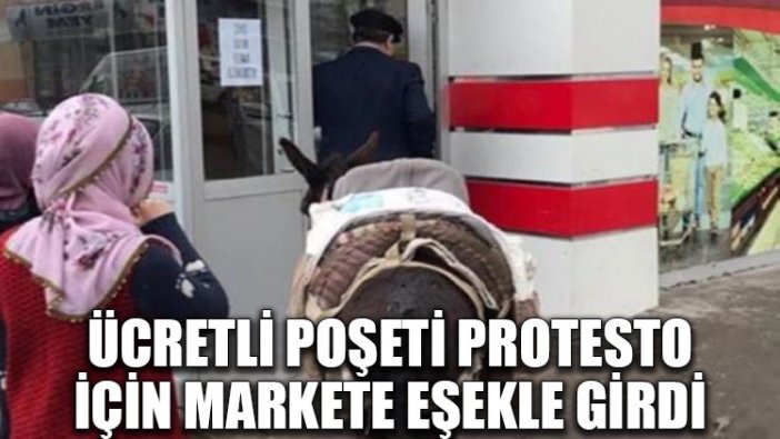 Ücretli poşeti protesto için markete eşekle girdi