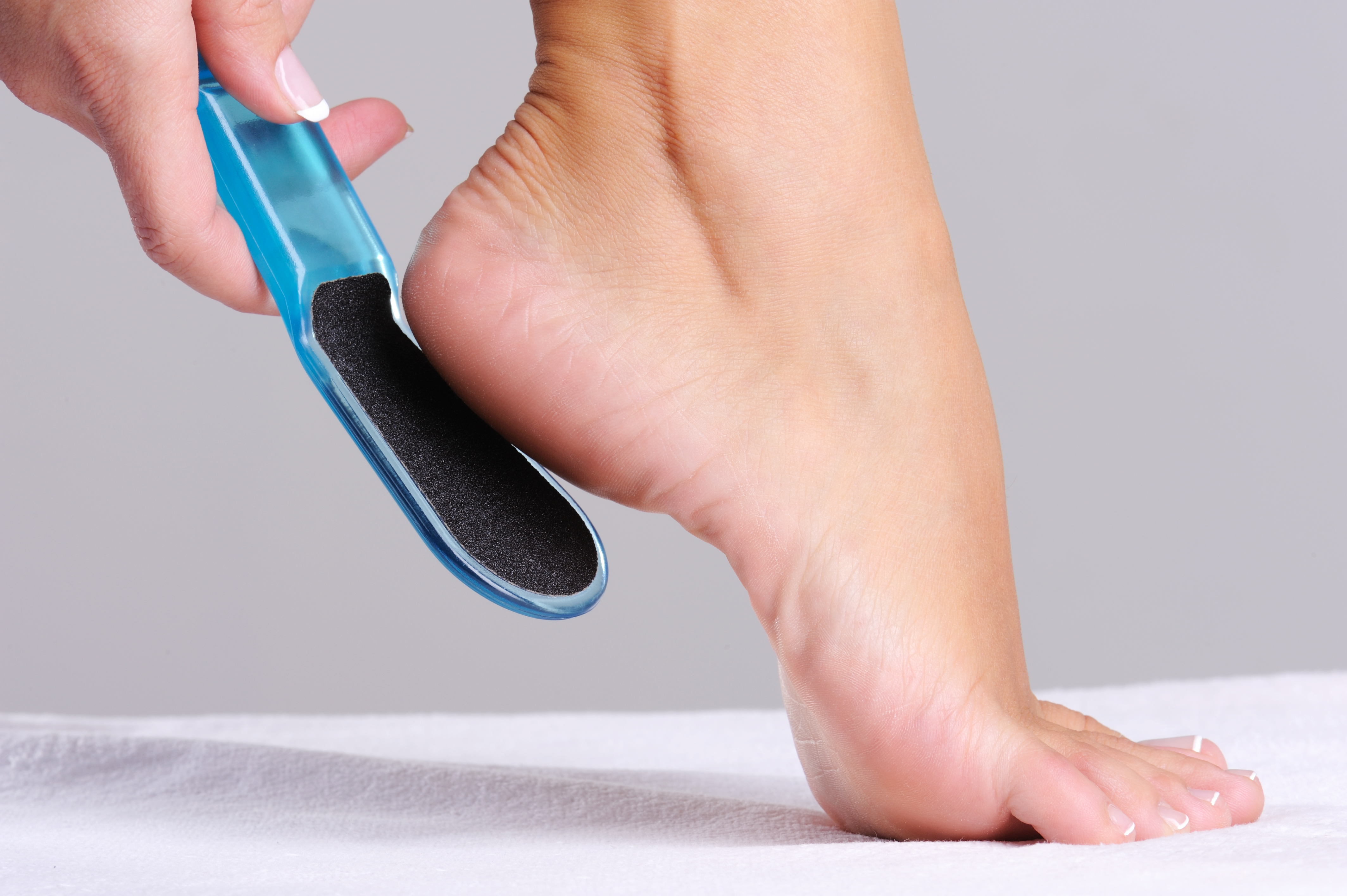 woman-scrubbing-heel-beauty-salon-use-tool-pedicure.jpg