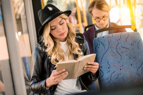 depositphotos-169741504-stock-photo-girl-reading-book-in-bus.webp