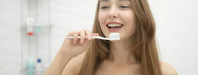 portrait-young-smiling-girl-cleaning-her-teeth-35-845x321-jpeg.webp