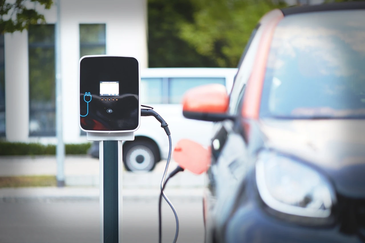 electric-car-by-charger.webp