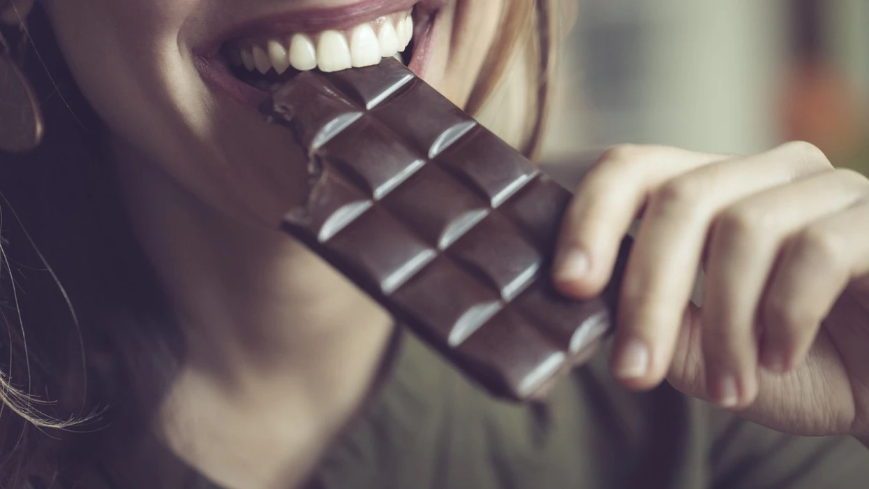close-up-of-a-woman-eating-dark-chocolate.webp